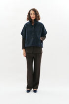 Holan poncho camel woman