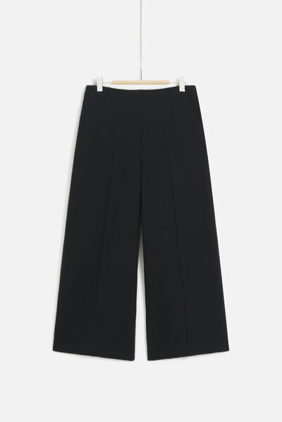 Pantalon pierce noir femme